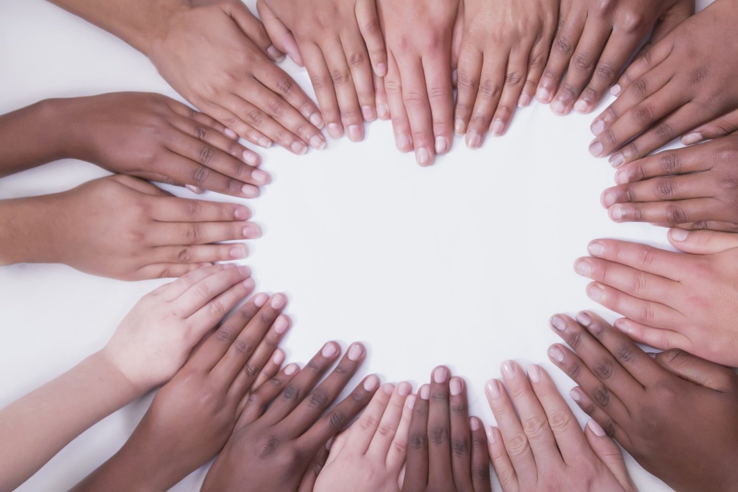 multicultural-hands-on-a-white-backdrop-in-a-heart